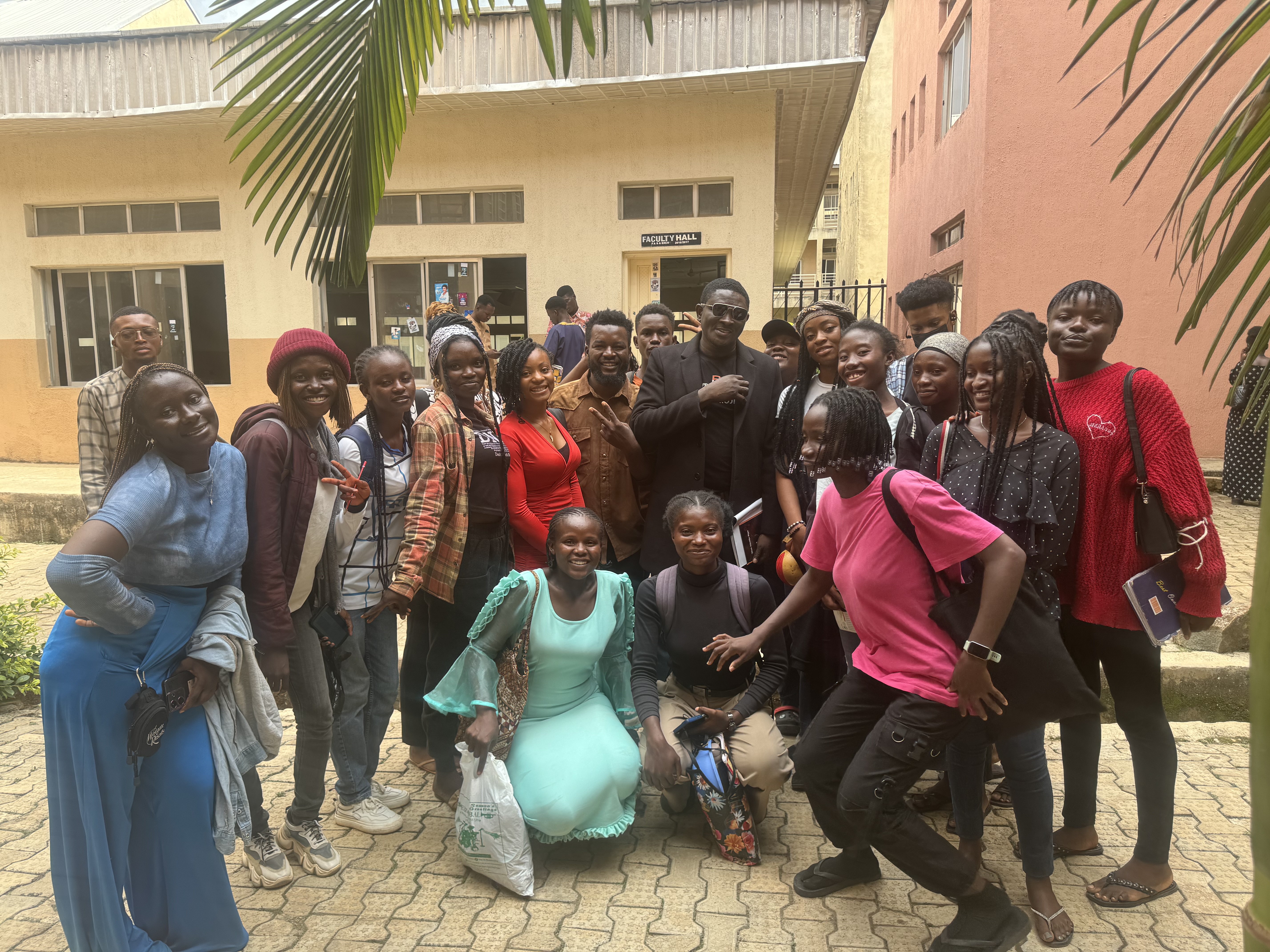 Students and Paul Ugbede in a group photo outside Faculty Hall