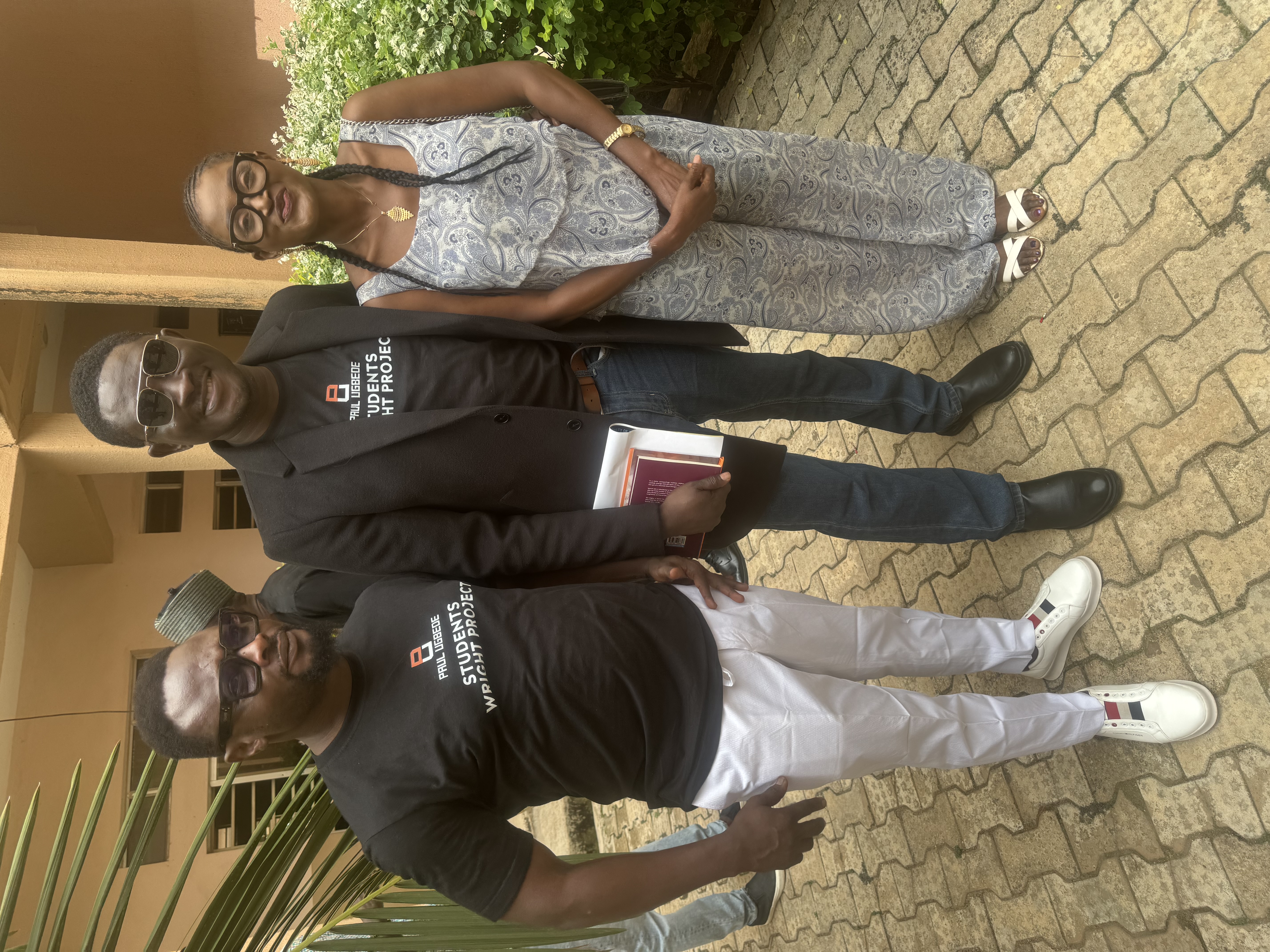 Paul Ugbede Students Wright Project team members and a student